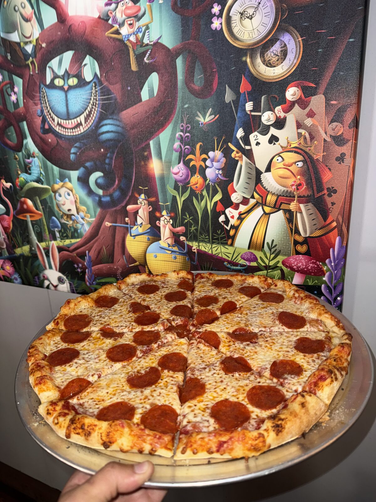 Queen's Classic wood-fired pizza with pepperoni and mozzarella at The Mad Hatter Saloon in Cascade, CO